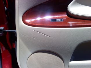 Lexus door panel repaired and dyed.